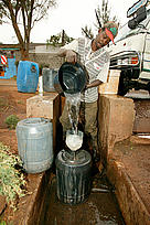 Filling plastic water containers at a water depot/ storage tank. Water is a threatened resource and ... / ©: Martin Harvey / WWF-Canon / ©: Martin Harvey / WWF-Canon